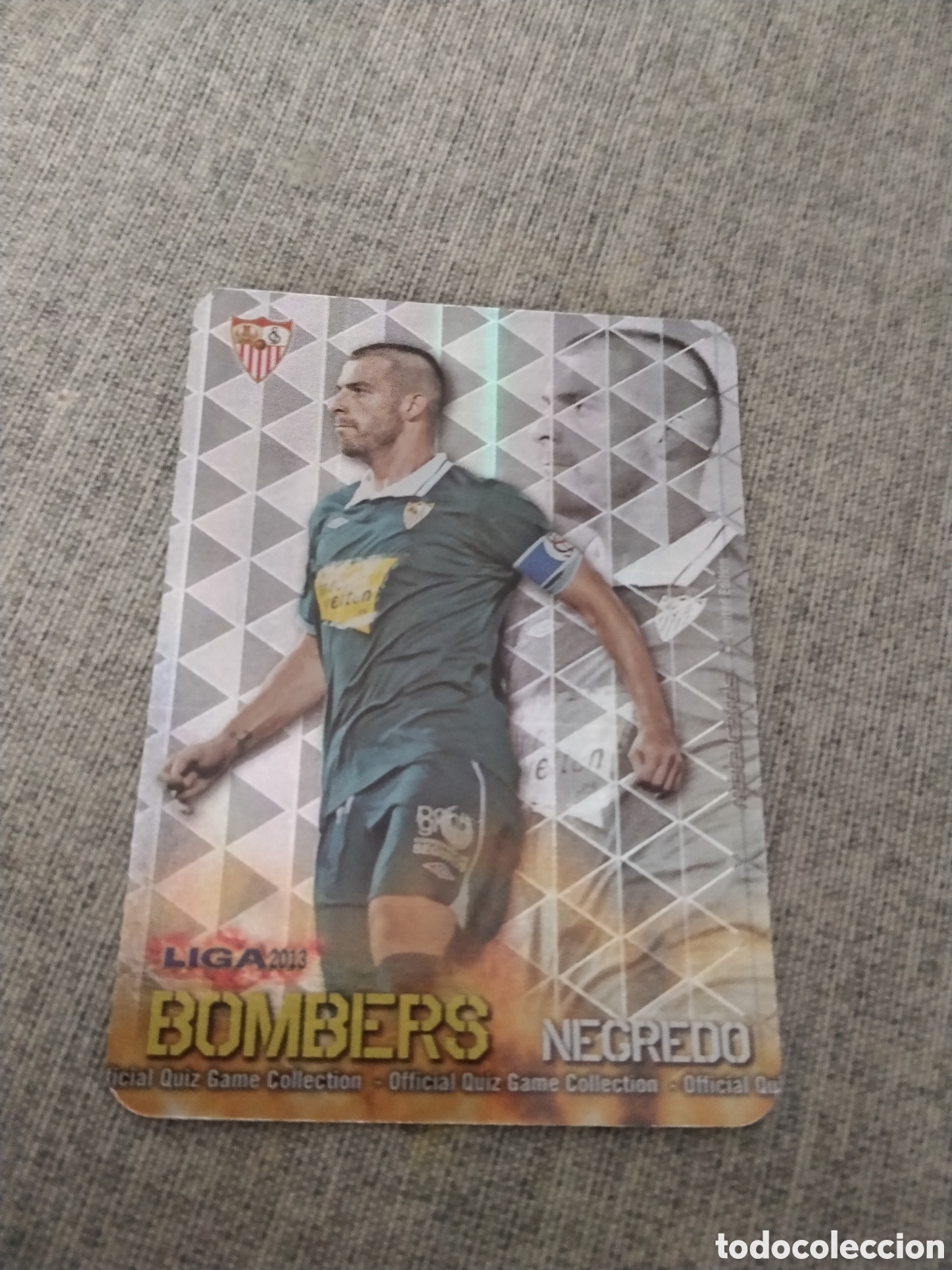 Figurine di Calcio: MUNDICROMO QUIZ GAME LIGA 2013 - METALCARD BOMBERS NEGREDO - SEVILLA CF ( FONDO RAYAS VERTICALES )