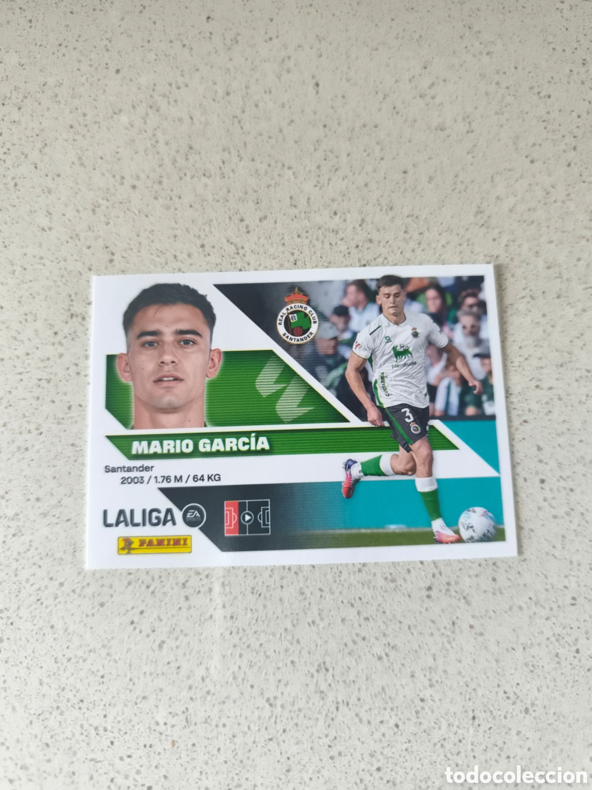 Figurine di Calcio: CROMO N&Uacute;MERO 9B MARIO GARCIA RACING DE SANTANDER. LIGA ESTE 26/27. PANINI.
