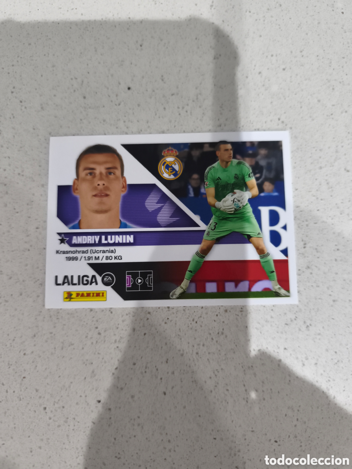 Cromos de f&uacute;tbol: CROMO N&Uacute;MERO 4 LUNIN REAL MADRID. LIGA ESTE 26/27. PANINI.