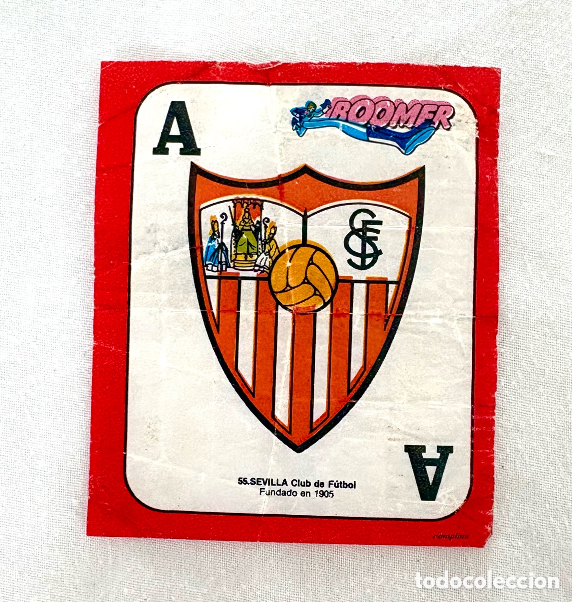Fu&szlig;ball-Sticker: CROMO 55 DIFICIL VERSI&Oacute;N LETRAS PEQUE&Ntilde;AS ESCUD&Oacute; SEVILLA ROJO BOOMER ASES DE LA LIGA 82 83 . Muy bien