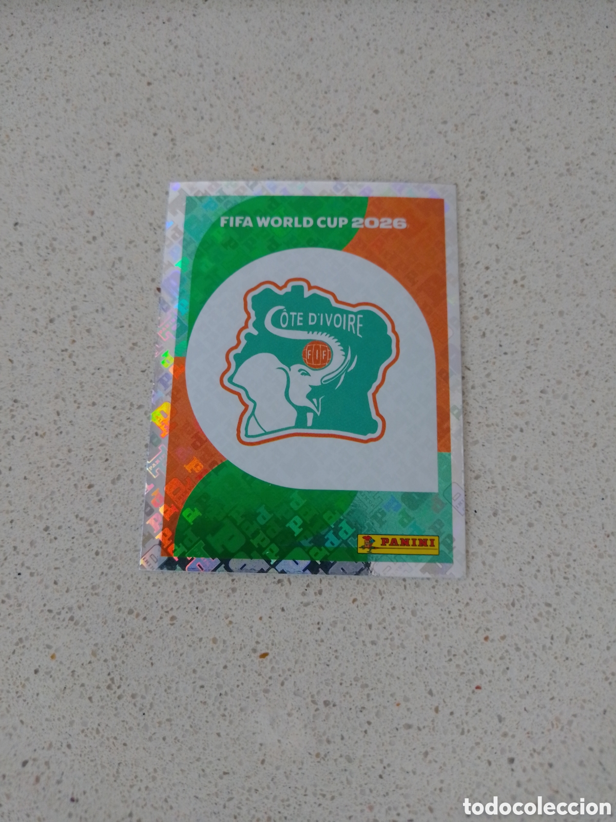 Cromos de f&uacute;tbol: CROMO NUMERO 1 ESCUDO COSTA DE MARFIL. MUNDIAL 2026. PANINI.