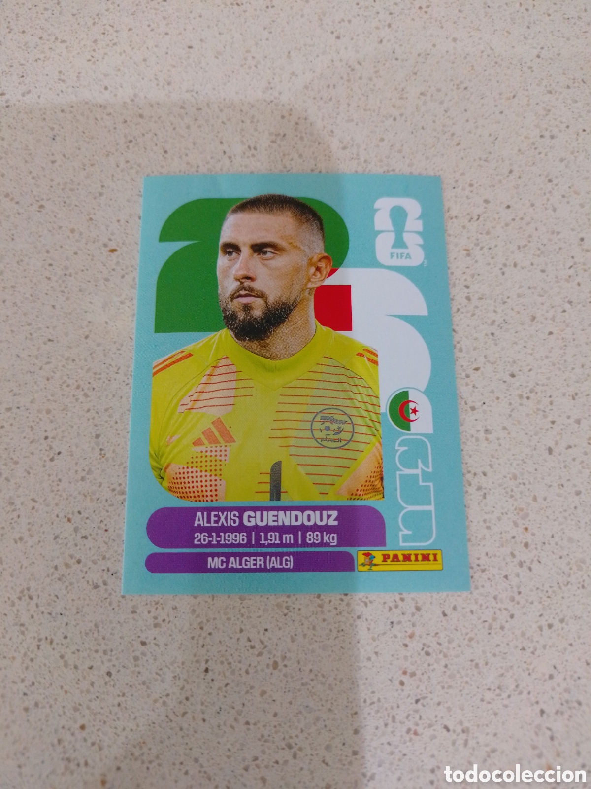 Figurine di Calcio: CROMO NUMERO 2 GUENDOUZ ARGELIA. MUNDIAL 2026. PANINI.