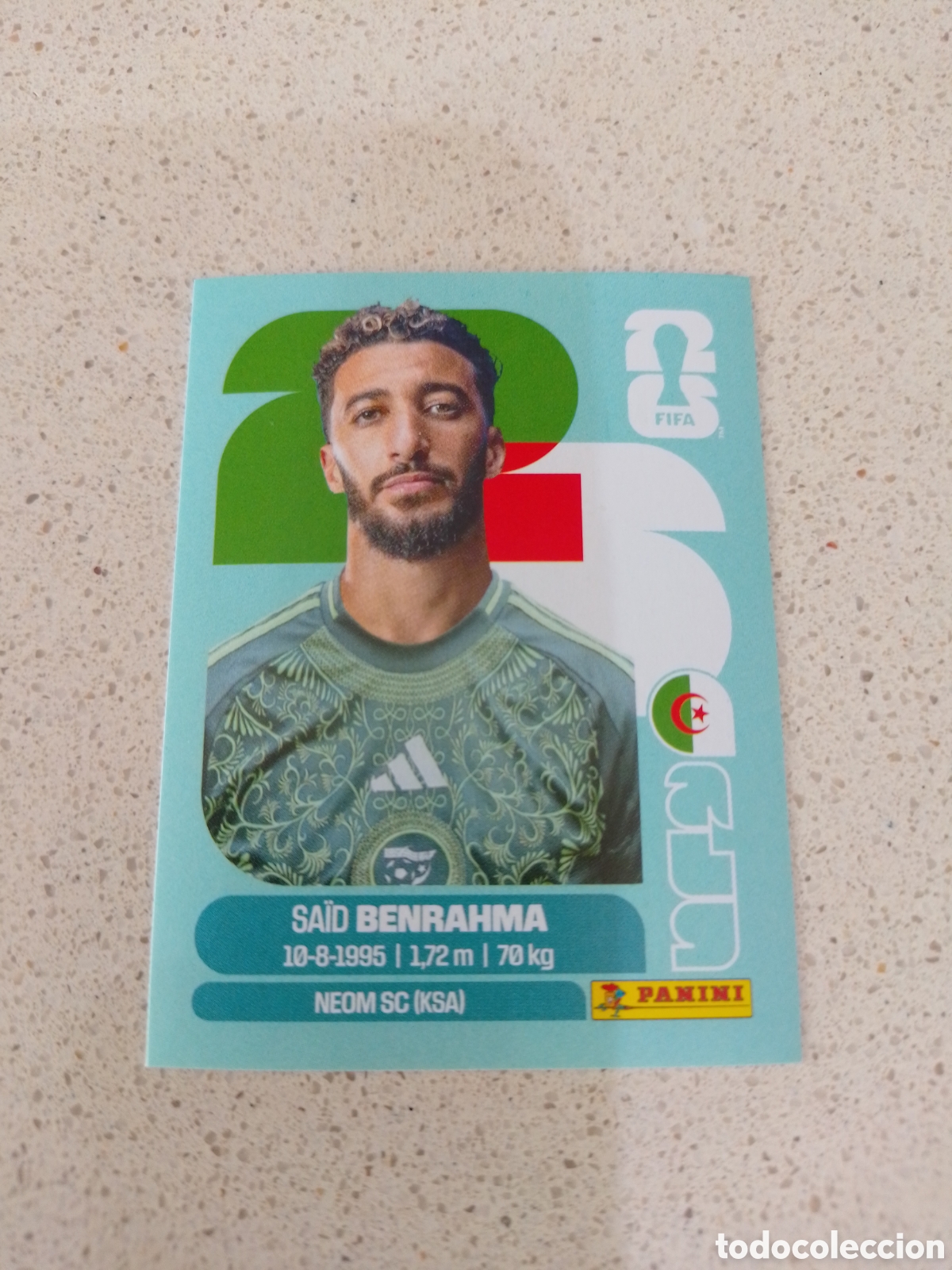 Figurine di Calcio: CROMO NUMERO 16 BENRAHMA ARGELIA. MUNDIAL 2026. PANINI.