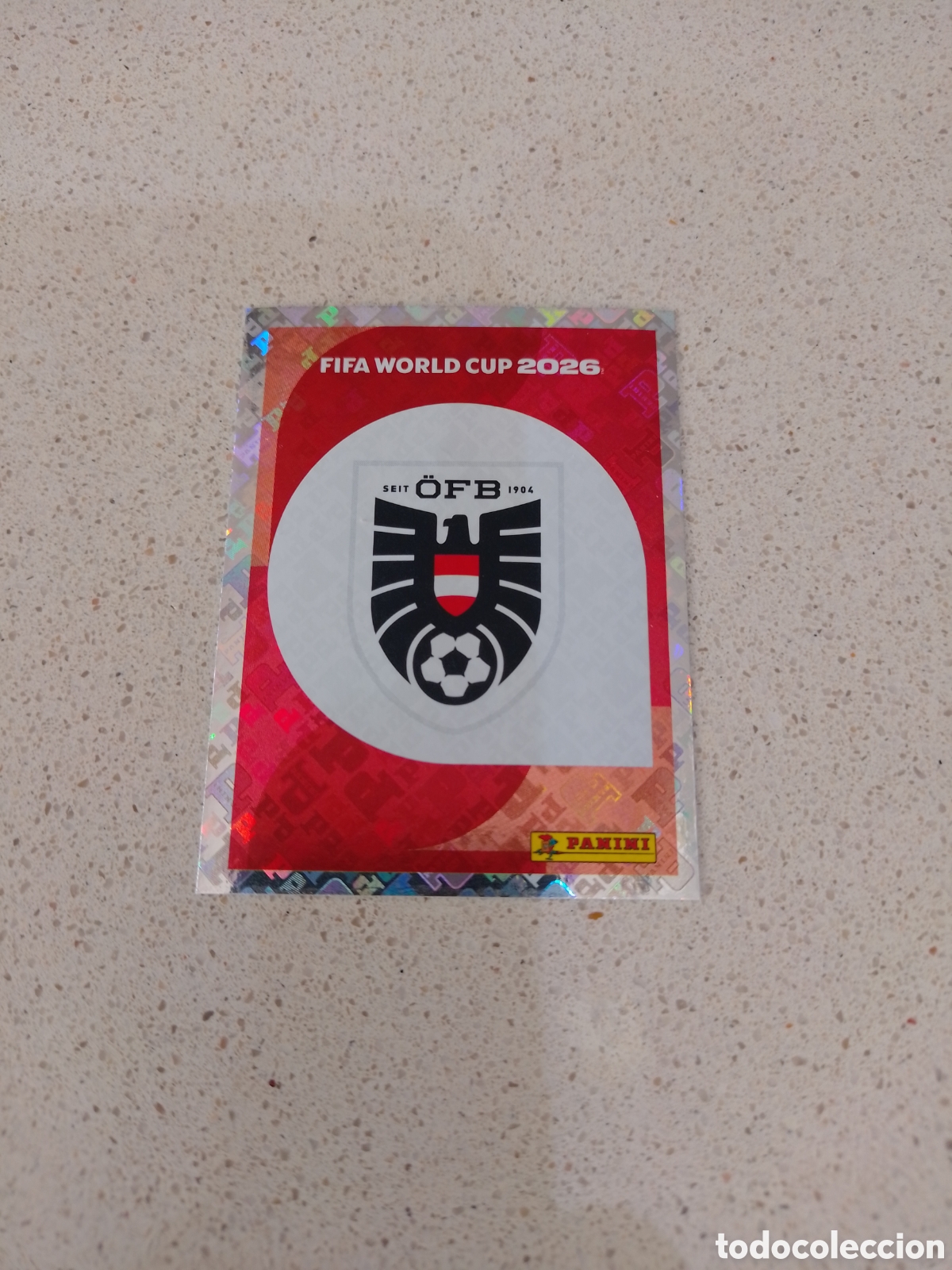 Figurine di Calcio: CROMO NUMERO 1 ESCUDO AUSTRIA. MUNDIAL 2026. PANINI.