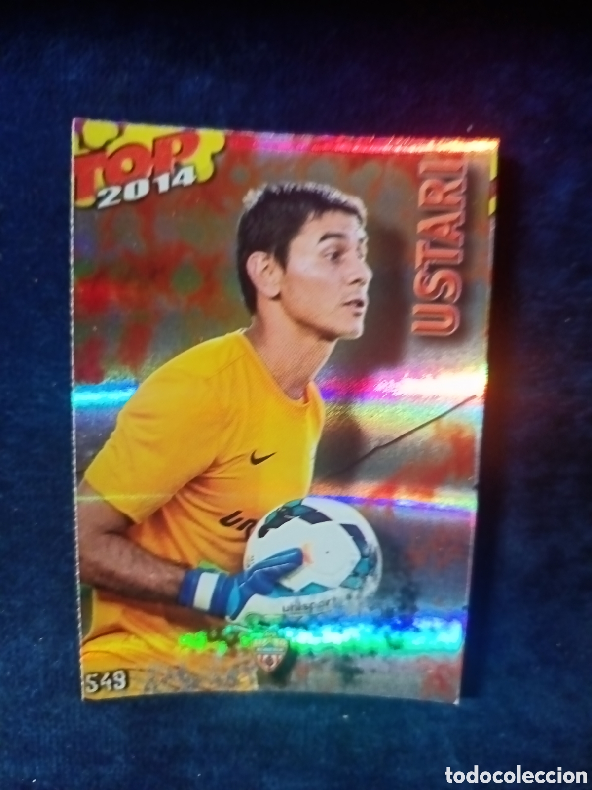 Cromos de f&uacute;tbol: 549 Ustari TOP BRILLO ROJO RAYAS - MUNDICROMO 2013 2014 13-14