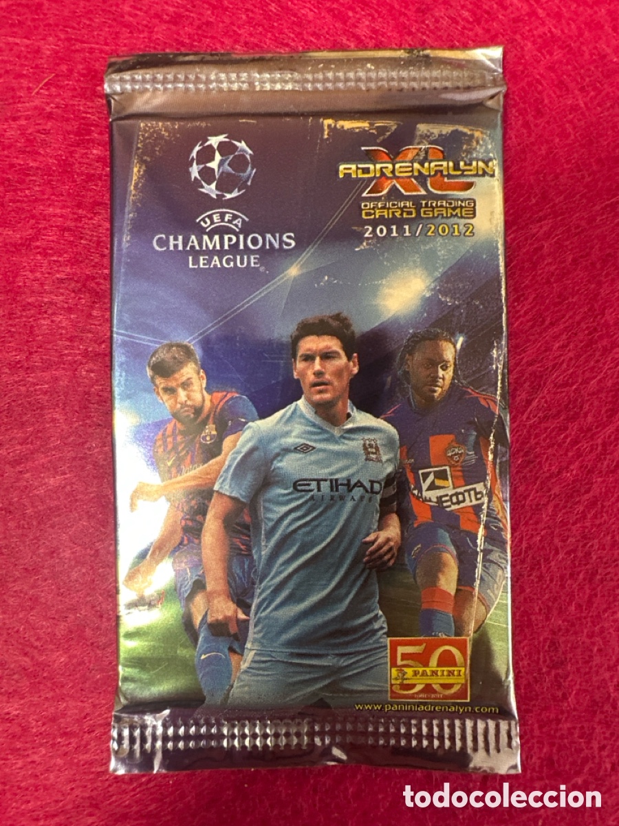 Cromos de f&uacute;tbol: SOBRE SIN ABRIR(MODELO PIQU&Eacute;)CHAMPIONS LEAGUE 2011-2012 11 12 PANINI TRADING CARDS