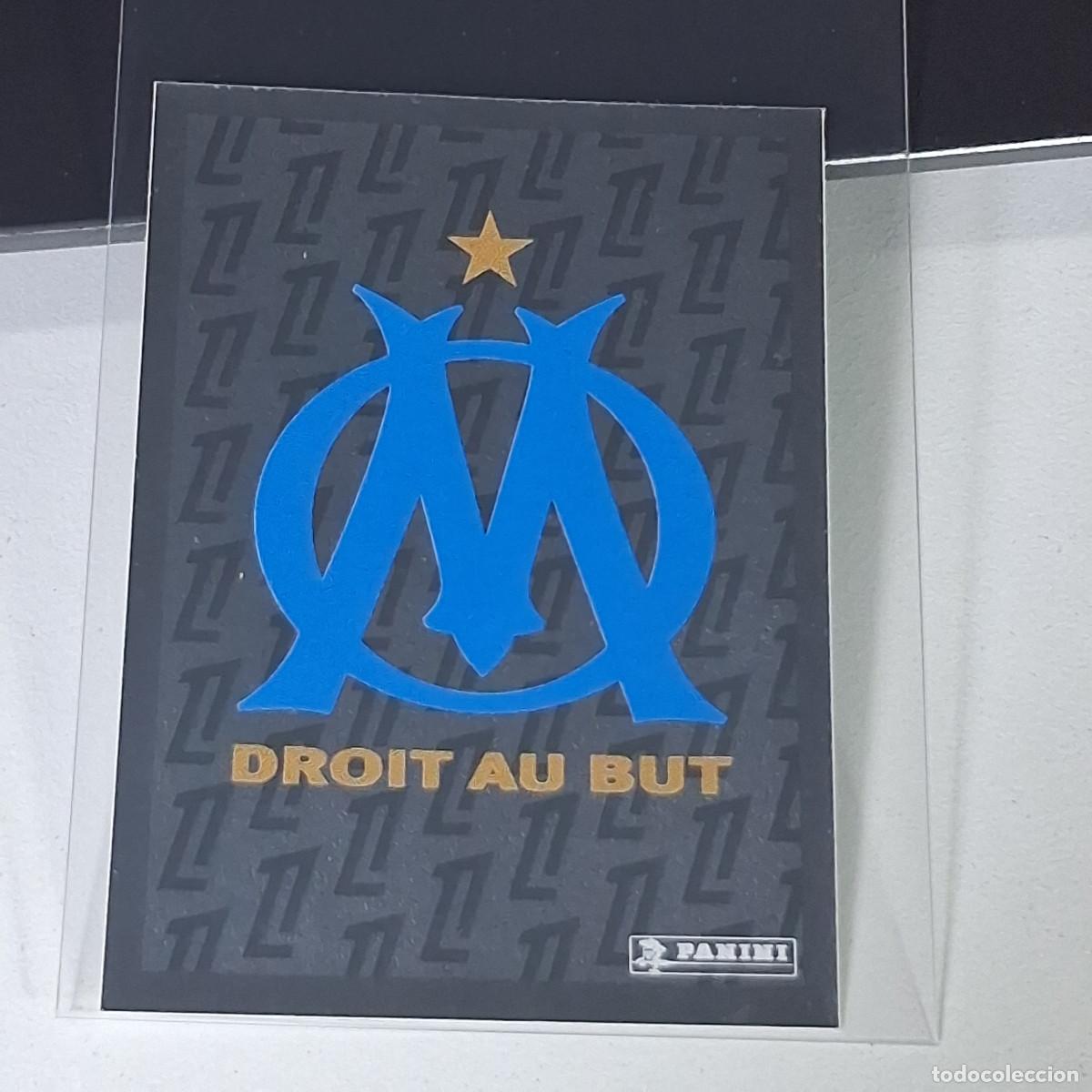 Cartes &agrave; collectionner de Football: B40 212 ESCUDO OLYMPIQUE MARSELLA CROMO FUTBOL PANINI LIGUE 1 FOOT 24-25 LIGA FRANCIA 2024-2025
