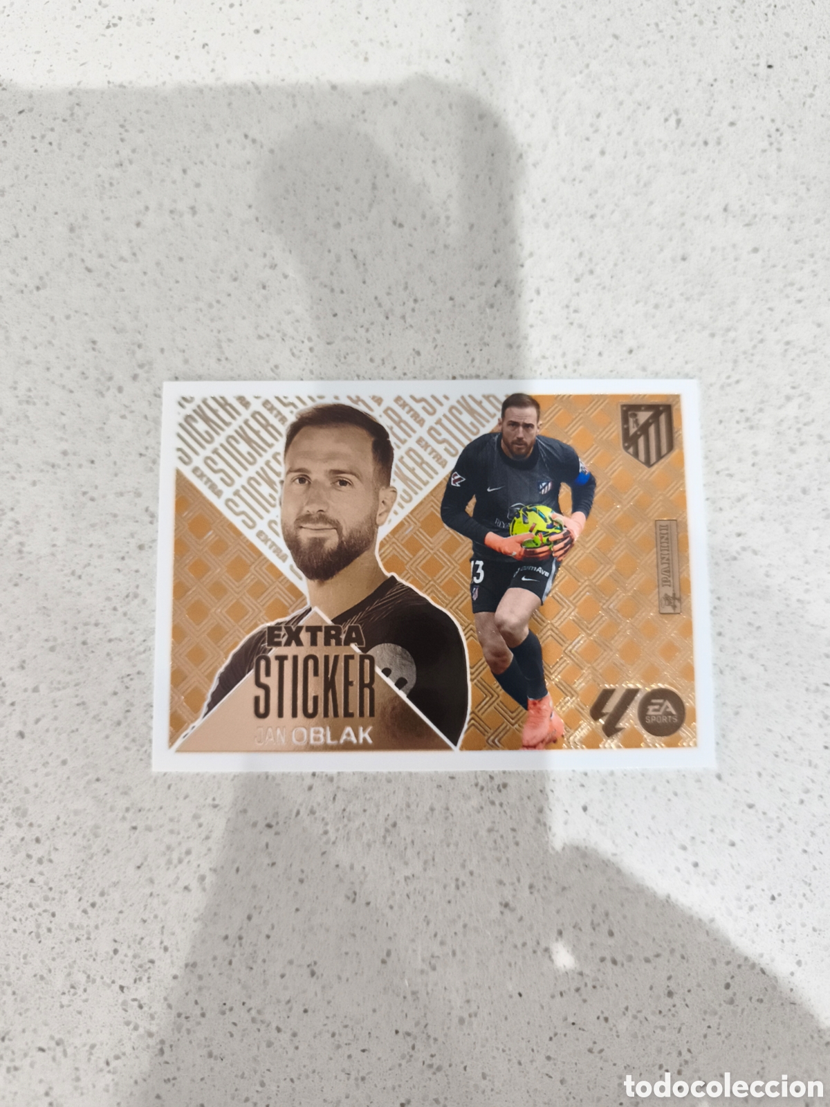 Cromos de f&uacute;tbol: CROMO EXTRA STICKER BRONCE OBLACK ATL&Eacute;TICO DE MADRID. LIGA ESTE 26/27. PANINI.