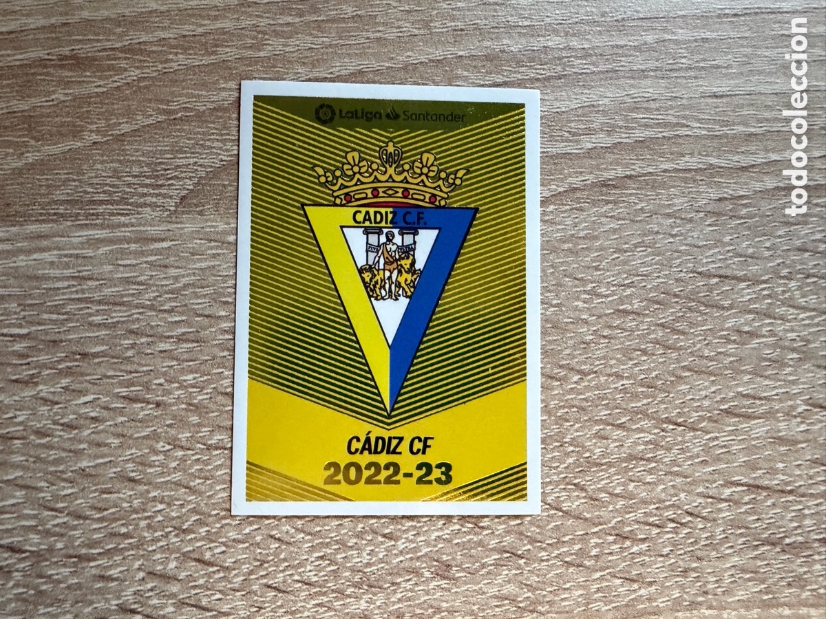 Cromos de f&uacute;tbol: ESCUDO C&Aacute;DIZ CF EDICIONES ESTE LIGA 2022 2023 22 23