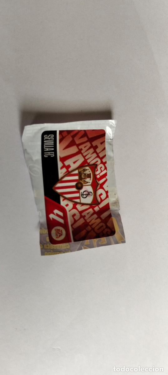 Cromos de f&uacute;tbol: CROMO CHICLE . LIGA ESTE 2026 - 27 ... ESCUDO REAL SEVILLA -- LEER ANUNCIO.