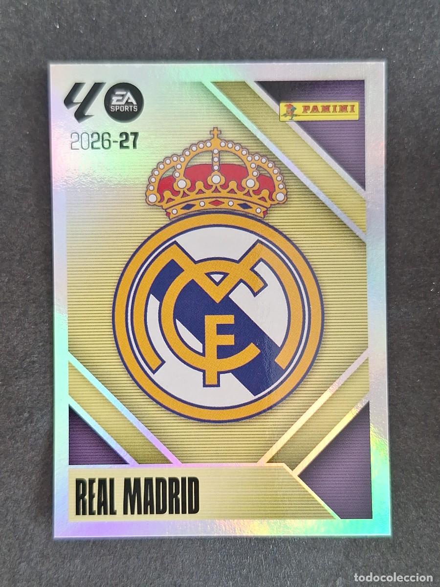 Cromos de f&uacute;tbol: L2 ESCUDO REAL MADRID LIGA ESTE 2026 2027 26 27 NUNCA PEGADO SIN PEGAR