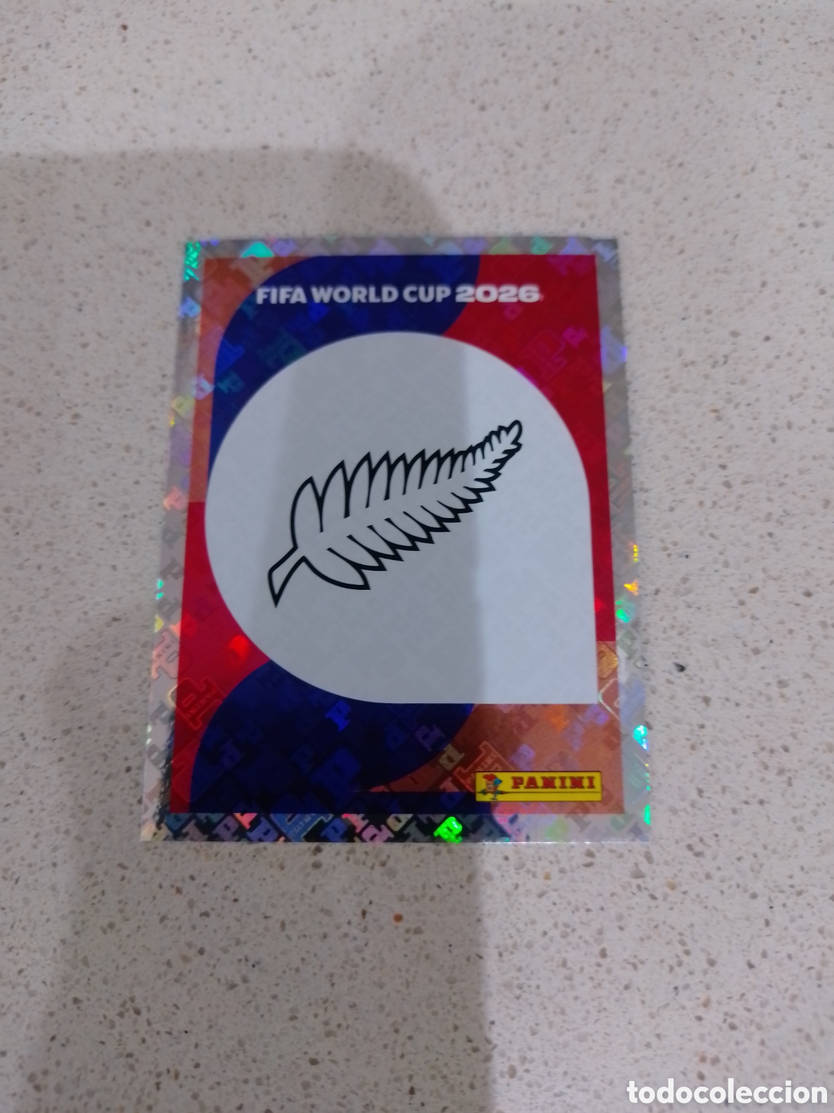Cromos de f&uacute;tbol: CROMO NUMERO 1 ESCUDO NUEVA ZELANDA. MUNDIAL 2026. PANINI.