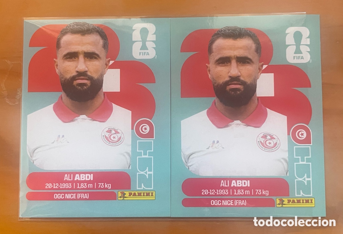 Cromos de f&uacute;tbol: PANINI MUNDIAL 2026 &ndash; ALI ABDI TUN 7 &ndash; VARIANTE ERROR DE IMPRESI&Oacute;N &ndash; DESPLAZAMIENTO