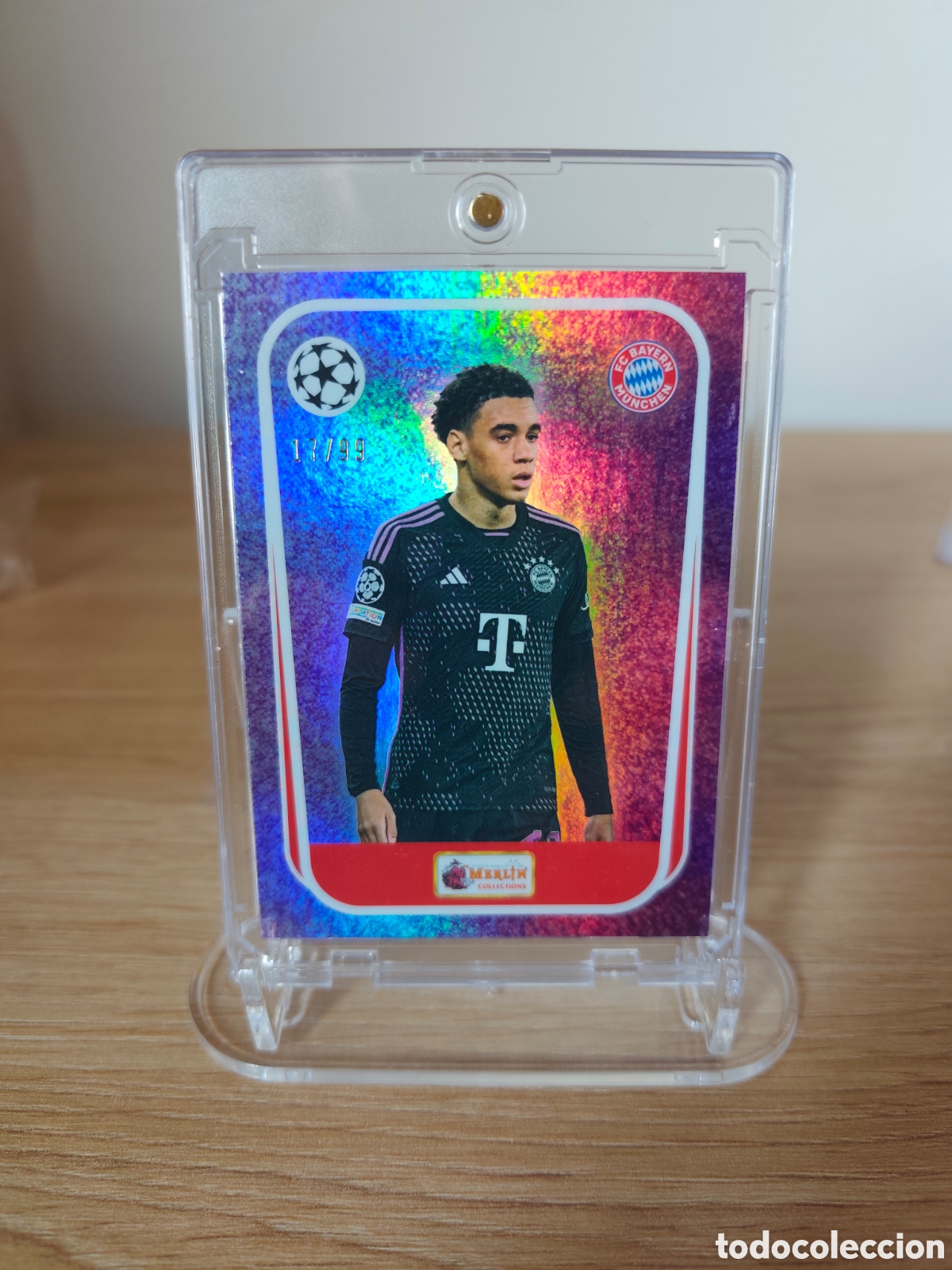 Cromos de f&uacute;tbol: Jamal Musiala Topps Merlin Heritage Most Wanted 17/99 Bayern M&uacute;nich Champions League