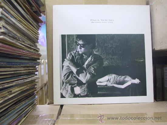 Discos de vinilo: PAUL YOUNG - BETWEEN TWO FIRES - EDICION ESPA&Ntilde;OLA - CBS 1986 - Foto 1