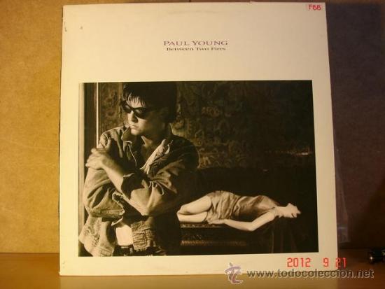 Discos de vinilo: Paul Young - Between Two Fires - CBS 450150 1 (SP) - 1986 - Foto 1