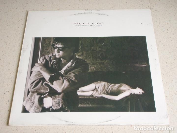 Discos de vinilo: PAUL YOUNG ( BETWEEN TWO FIRES ) 1986-HOLANDA LP33 CBS - Foto 1