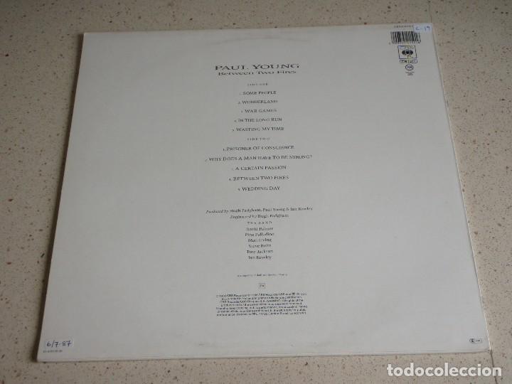 Discos de vinilo: PAUL YOUNG ( BETWEEN TWO FIRES ) 1986-HOLANDA LP33 CBS - Foto 2