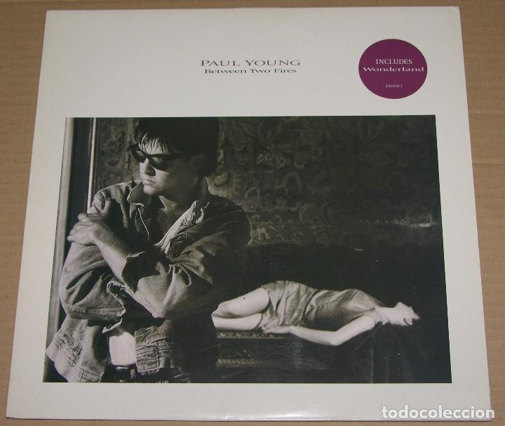 Discos de vinilo: PAUL YOUNG - BETWEEN TWO FIRES - 1986 CBS ENGLAND - Foto 1