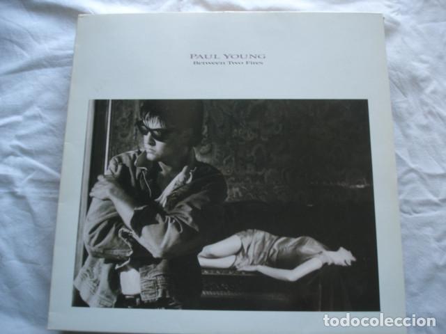 Discos de vinilo: Paul Young   Between Two Fires - Foto 1