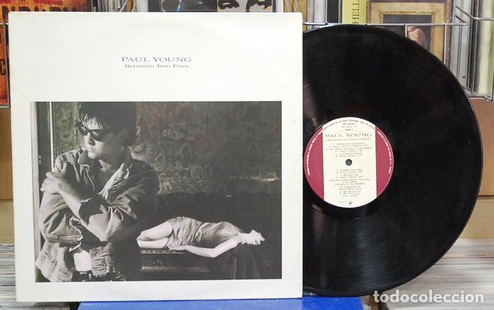 Discos de vinilo: Paul Young. Between two fires. CBS 1986, ref. 450150 1. LP - Foto 1