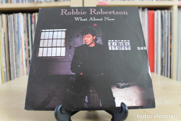 Discos de vinilo: ROBIE ROBERTSON -SG- WHAT ABOUT NOW SPAIN 90'S