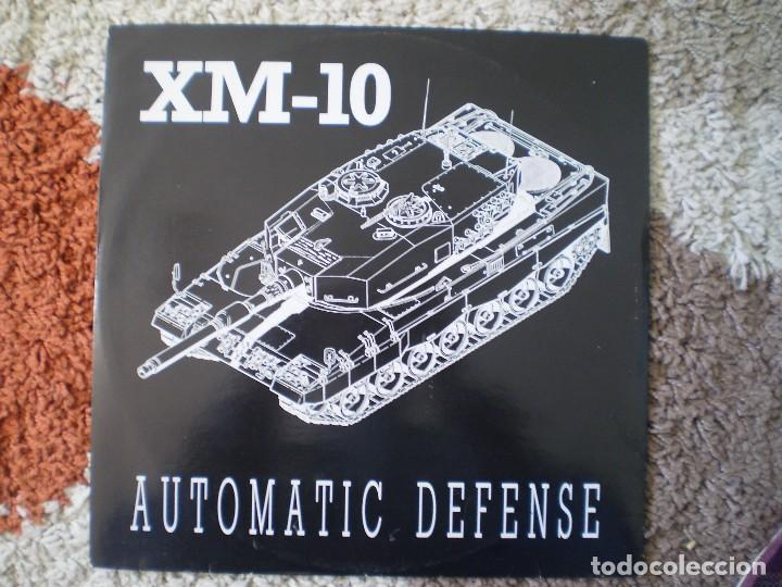 Discos de vinilo: MAXI 12 PULGADAS. XM-10. AUTOMATIC DEFENSE. - Foto 1