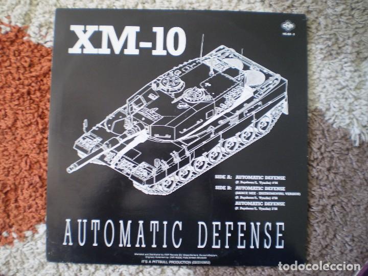 Discos de vinilo: MAXI 12 PULGADAS. XM-10. AUTOMATIC DEFENSE. - Foto 2