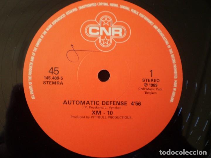Discos de vinilo: MAXI 12 PULGADAS. XM-10. AUTOMATIC DEFENSE. - Foto 3
