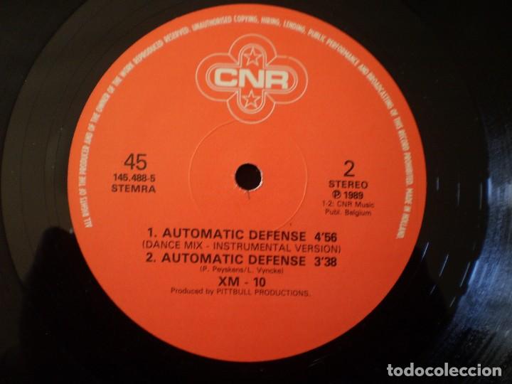 Discos de vinilo: MAXI 12 PULGADAS. XM-10. AUTOMATIC DEFENSE. - Foto 4