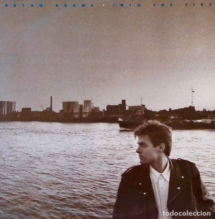 Discos de vinilo: BRYAN ADAMS INTO THE FIRE. LP ESPA&Ntilde;A CON P&Oacute;STER - Foto 1