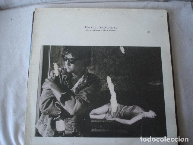 Discos de vinilo: Paul Young   Between Two Fires - Foto 1