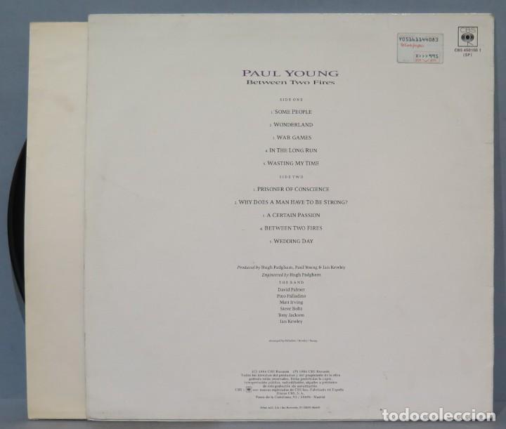 Discos de vinilo: LP. PAUL YONG. BETWEEN TWO FIRES - Foto 2