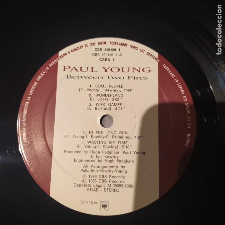 Discos de vinilo: Paul Young, Between two Fires, Edicion de 1986 de ESpa&ntilde;a - Foto 2