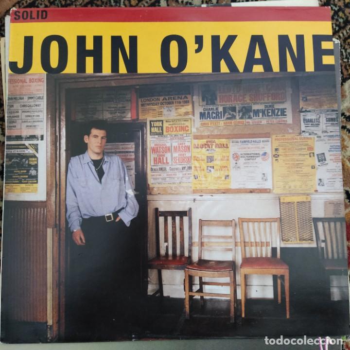 Discos de vinilo: John OKane - Solid (LP, Album) (1991/UK) - Foto 1