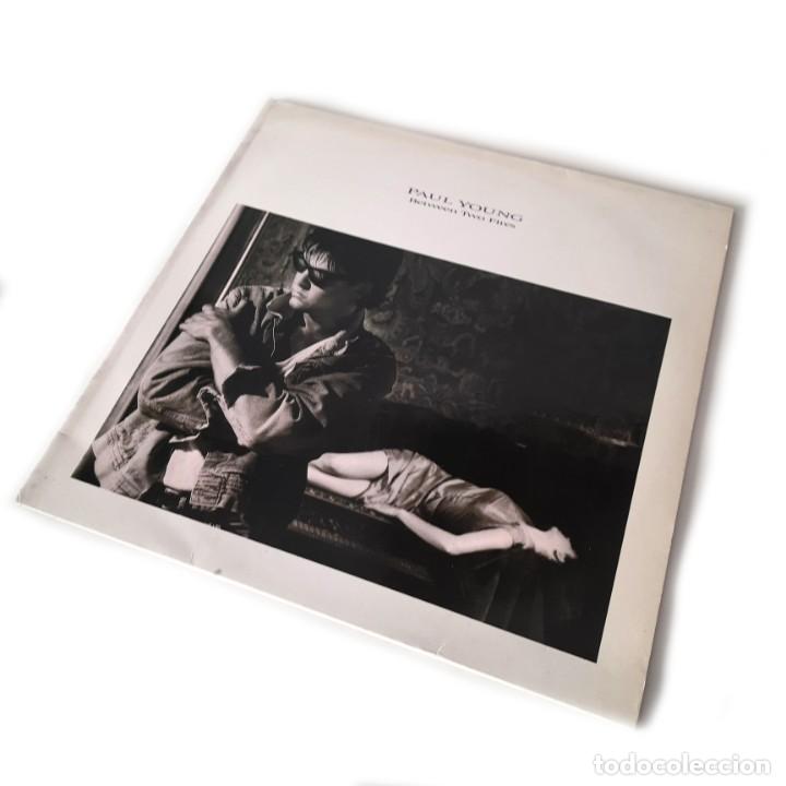 Discos de vinilo: Paul Young - Between Two Fires - Foto 1