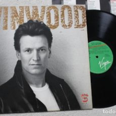 Discos de vinilo: STEVE WINWOOD ROLL WITH IT LP VINYL MADE IN SPAIN 1988