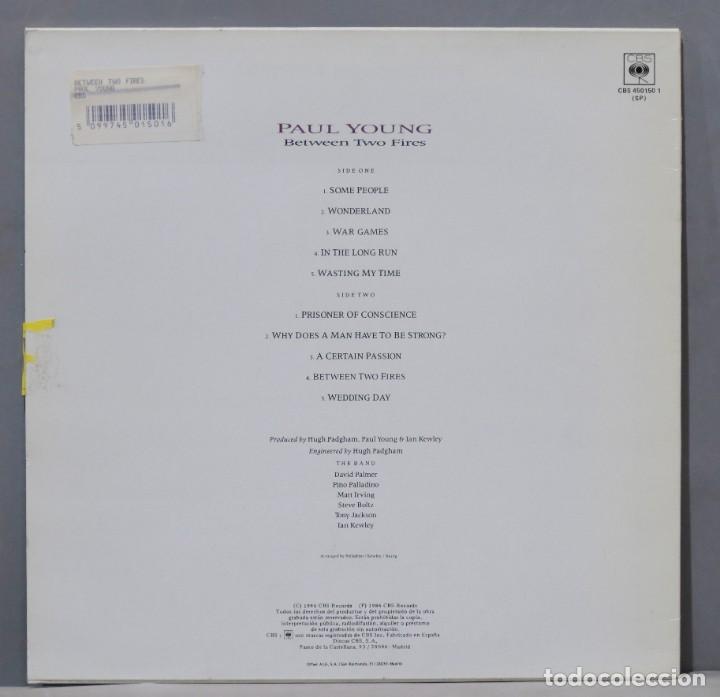 Discos de vinilo: LP. Paul Young &ndash; Between Two Fires - Foto 2
