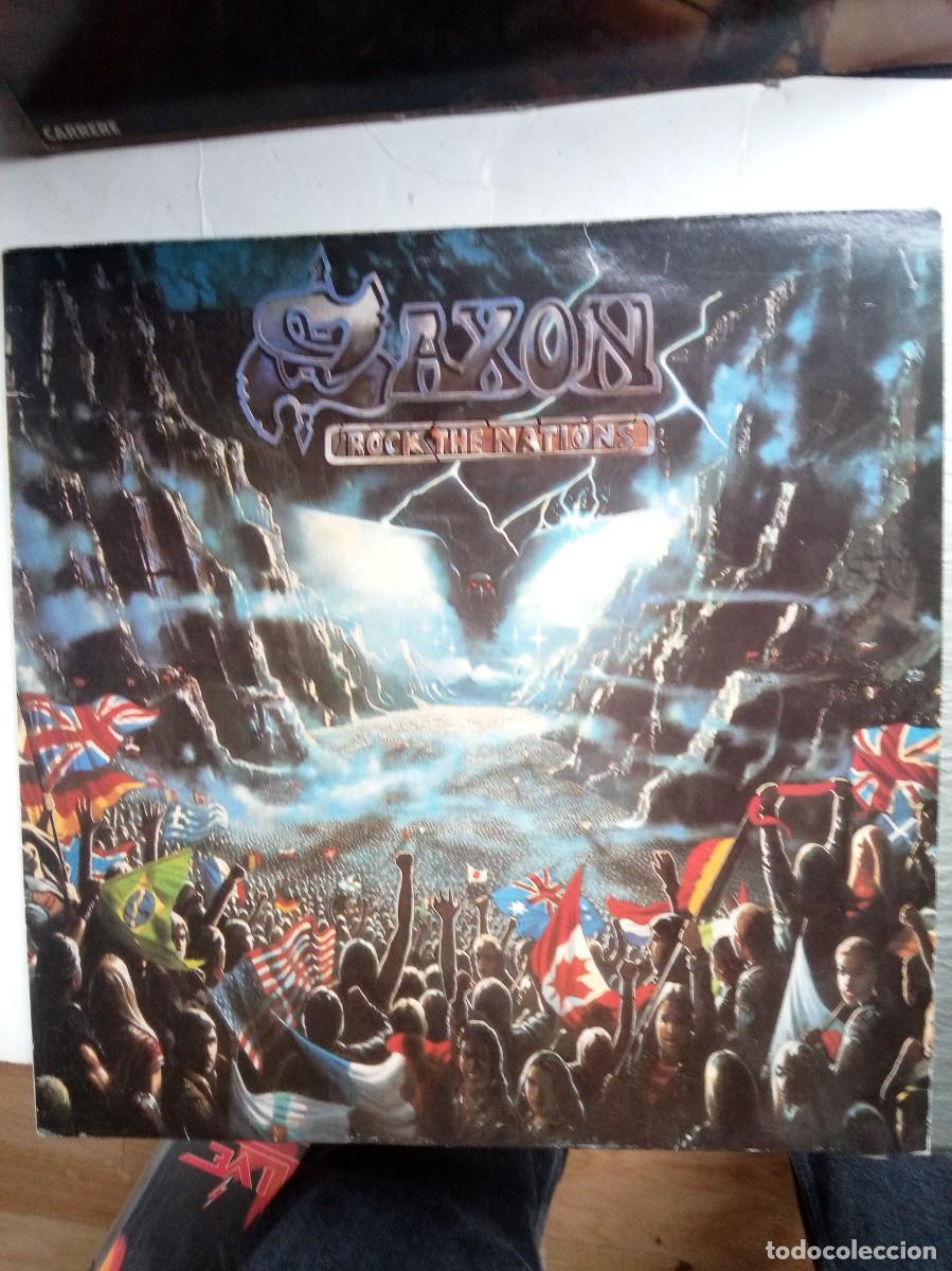 Discos de vinilo: saxon rock the nations 1986 insert lp - Foto 1