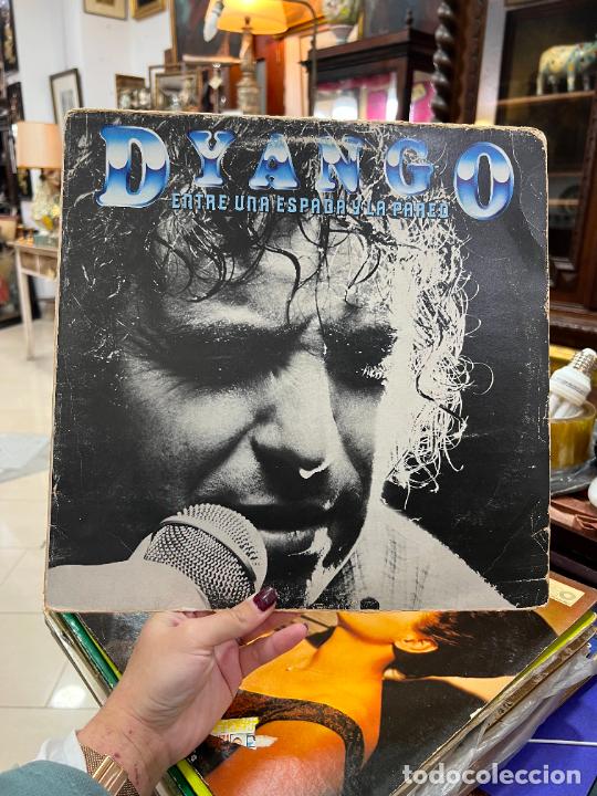 Discos de vinilo: LP DYANGO - ENTRE UNA ESPADA Y LA PARED - Foto 1
