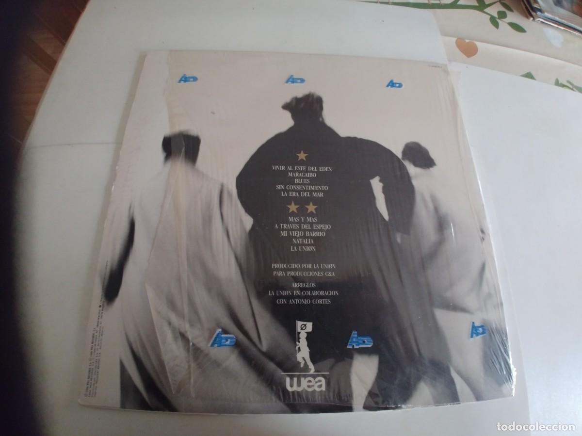 Discos de vinilo: LA UNION-LP VIVIR AL ESTE DEL EDEN-LETRAS - Foto 2