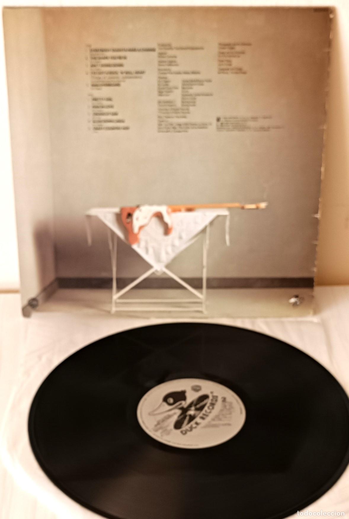 Discos de vinilo: ERIC CLAPTON - MONEY AND CIGARETTES DUCK - 1983 - Foto 2