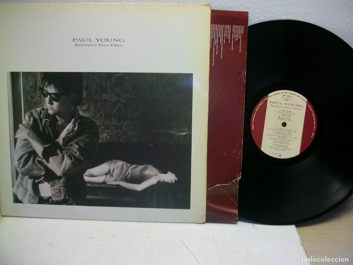Discos de vinilo: Paul Young &ndash; Between Two Fires LP - Foto 1