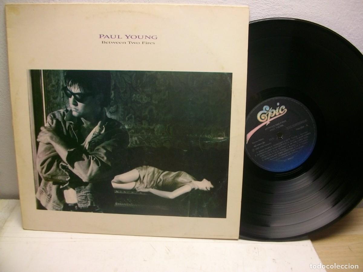 Discos de vinilo: Paul Young &ndash; Between Two Fires LP - Foto 1