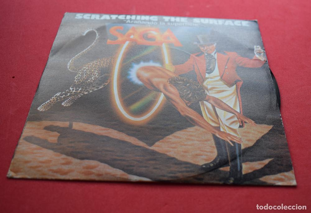 Discos de vinilo: SAGA - ARA&Ntilde;ANDO LA SUPERFICIE - SCRATCHING THE SURFACE - SINGLE 7  - - Foto 1
