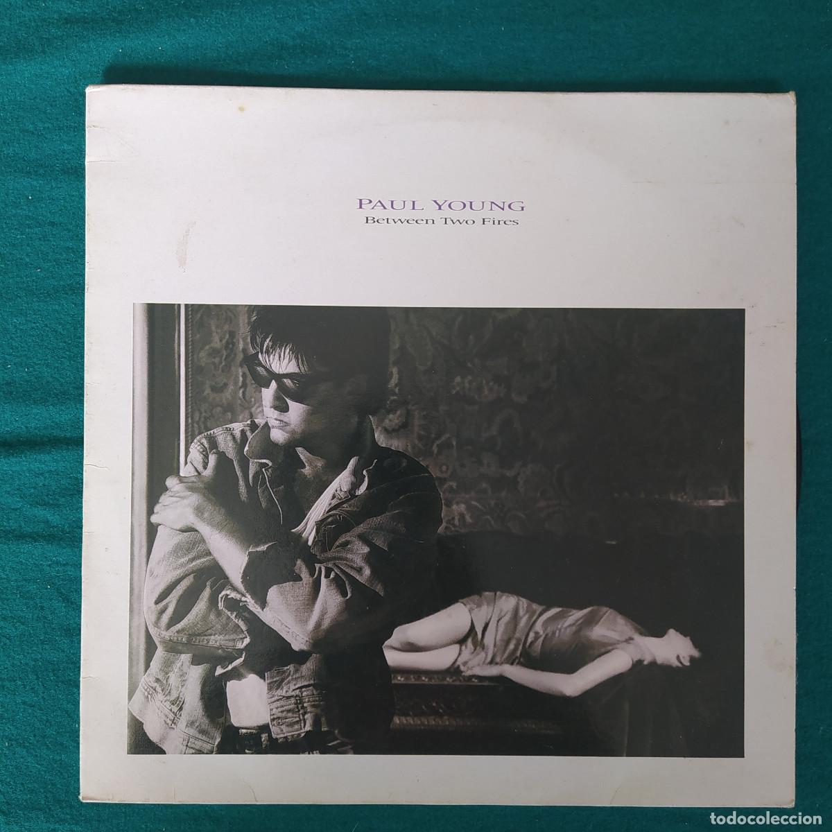 Discos de vinilo: Paul Young &ndash; Between Two Fires - Foto 1