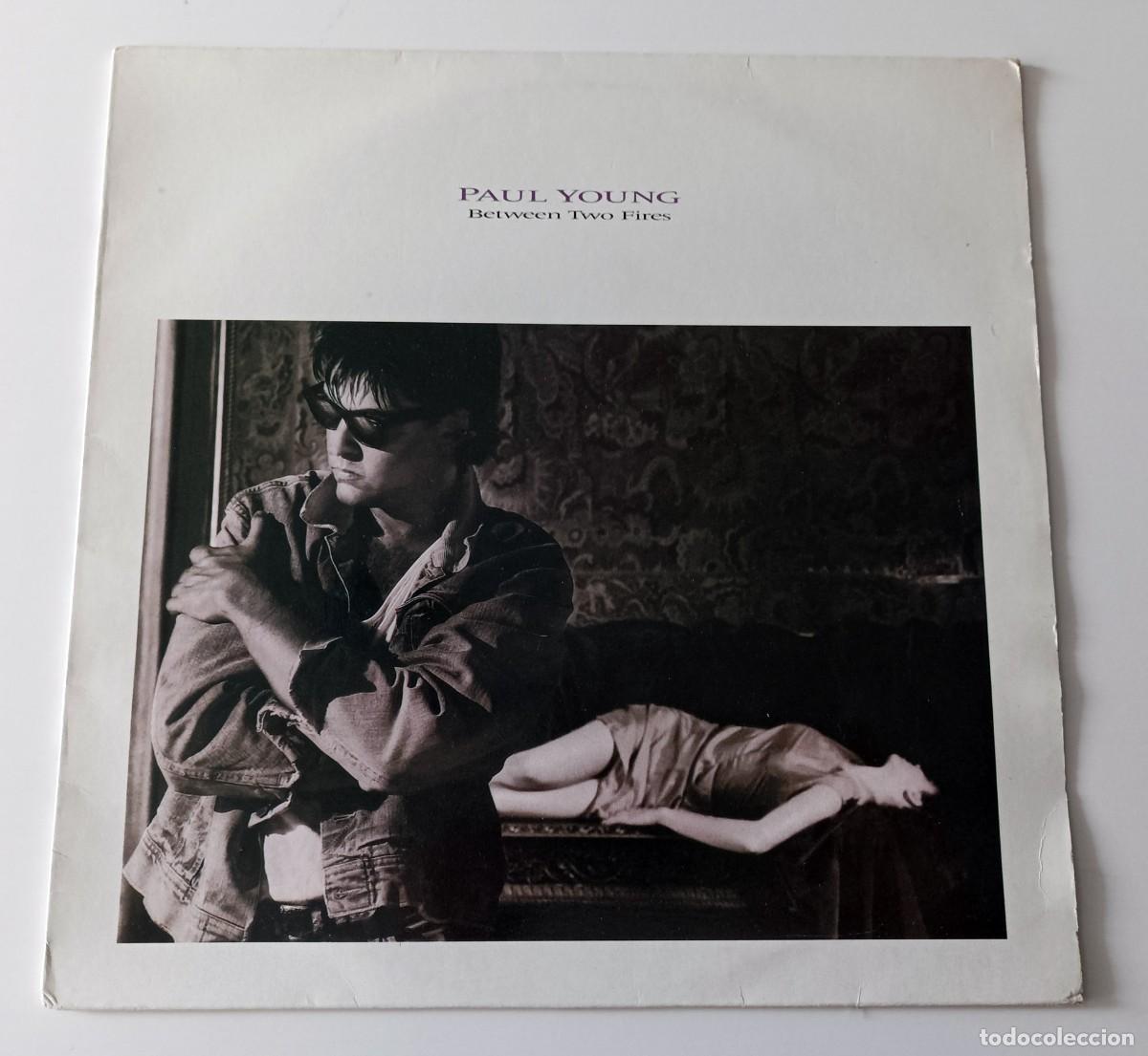 Discos de vinilo: LP PAUL YOUNG - BETWEEN TWO FIRES - Foto 1