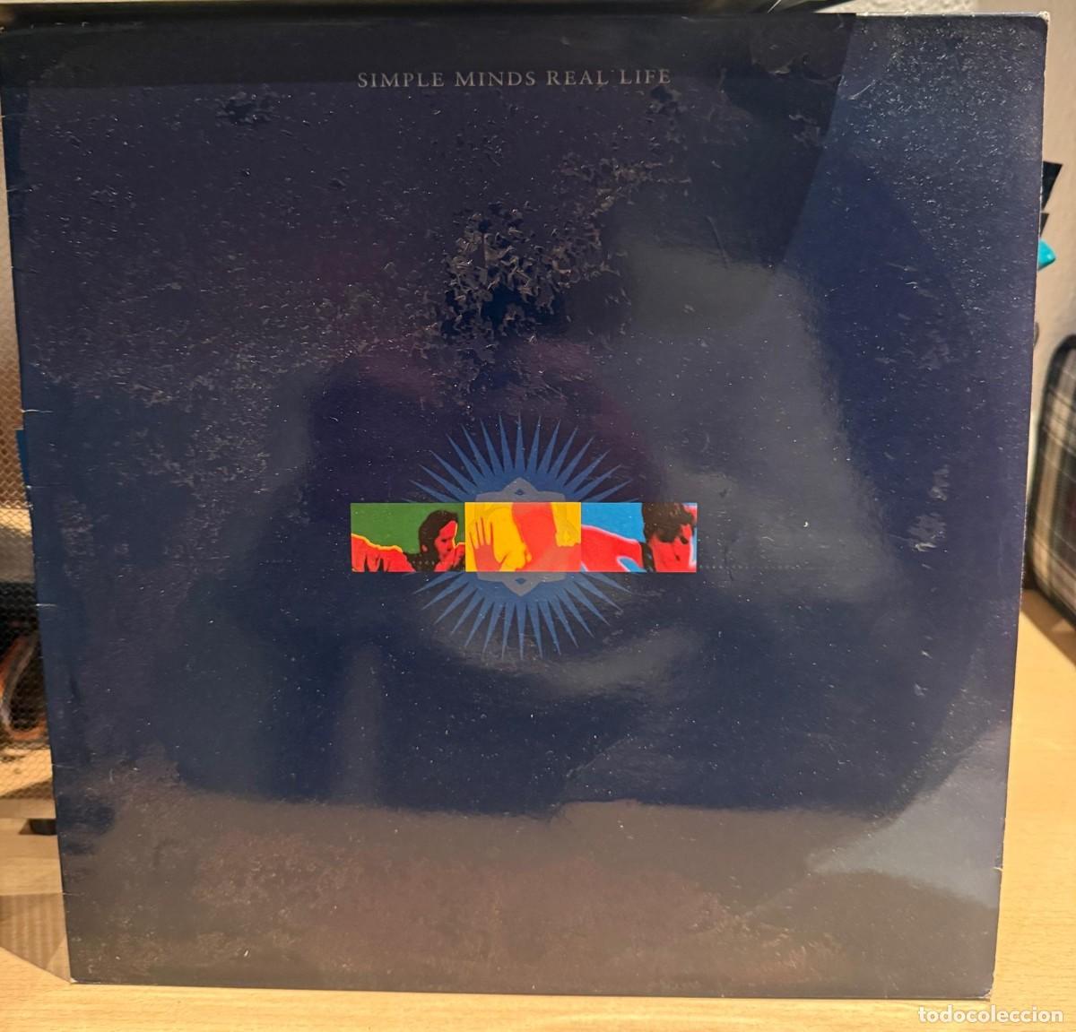 Discos de vinilo: Simple Minds &lrm;&ndash; Real Life. Disco vinilo. Edic. Spain. 1991 - Foto 1