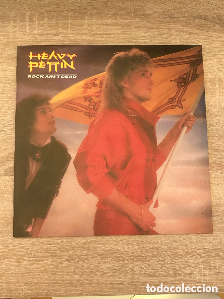 Discos de vinilo: HEAVY PETTIN - ROCK AIN'T DEAD Edicion poligram ib&eacute;rica Espa&ntilde;a 1985