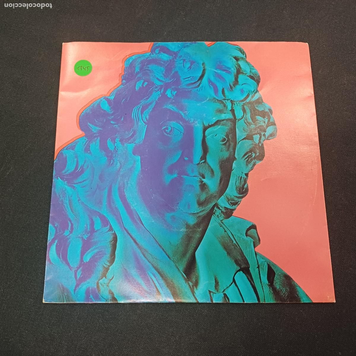 Discos de vinilo: NEW ORDER/ROUND & ROUND/SINGLE.